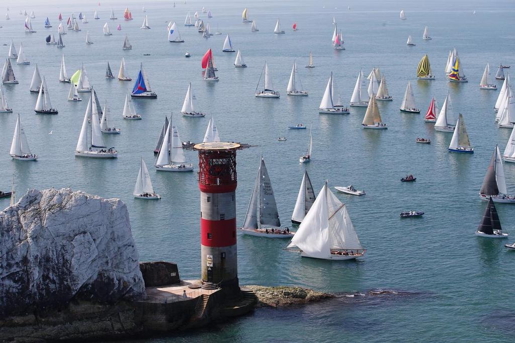 Boats meet the treacherous Isle of Wight landmark, The Needles. Navigating around their sharp and jagged rocks will be no easy feat. JP Morgan Asset Management Round the Island Race 2014. © Th.Martinez/onEdition