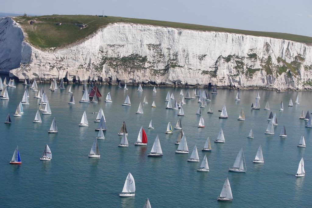 Boats meet the treacherous Isle of Wight landmark, The Needles. Navigating around their sharp and jagged rocks will be no easy feat. JP Morgan Asset Management Round the Island Race 2014. © Th.Martinez/onEdition