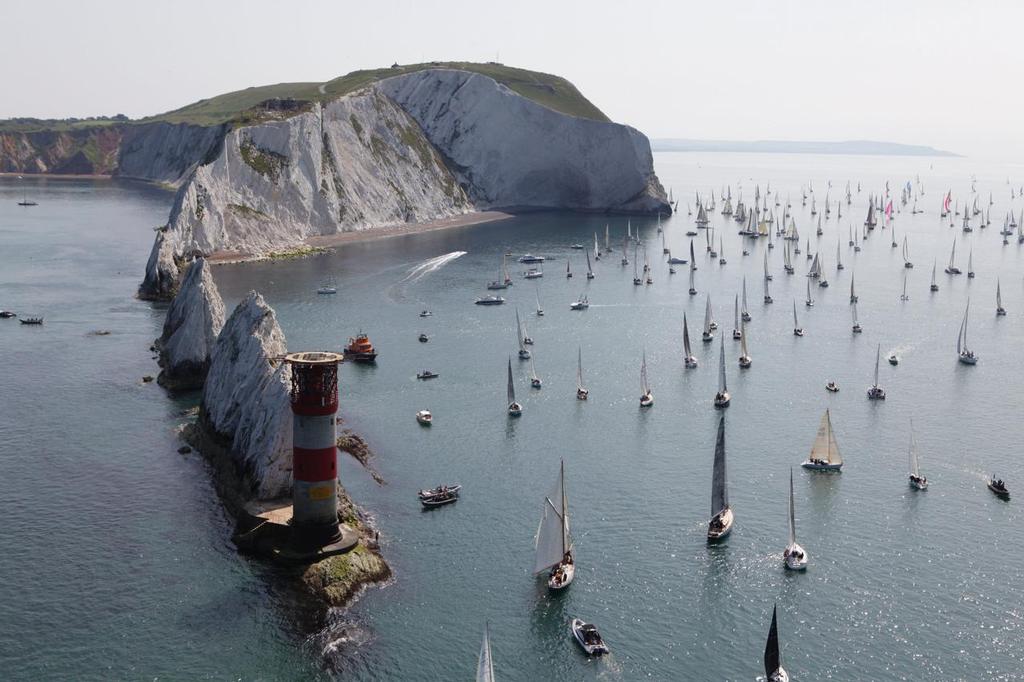 Boats meet the treacherous Isle of Wight landmark, The Needles. Navigating around their sharp and jagged rocks will be no easy feat. JP Morgan Asset Management Round the Island Race 2014. photo copyright Th.Martinez/onEdition taken at  and featuring the  class