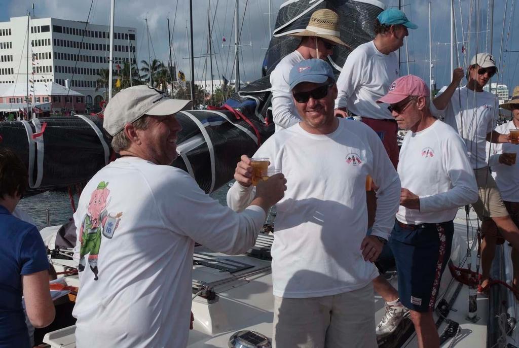 The crew of Glim celebrate thair arrival in Bermuda with a traditional Dark 'n Stormy. 2014 Newport Bermuda Race photo copyright Barry Pickthall/PPL http://www.pplmedia.com taken at  and featuring the  class