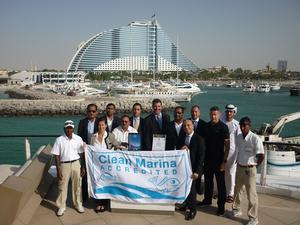 John Hogan, Superior, (centre) presenting Jumeirah Beach Hotel Marina management & staff with their Clean Marina accreditation photo copyright Marina Industry Association (MIA) http://www.marinas.net.au taken at  and featuring the  class