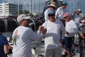 The crew of Glim celebrate thair arrival in Bermuda with a traditional Dark 'n Stormy. photo copyright Barry Pickthall / PPL taken at  and featuring the  class