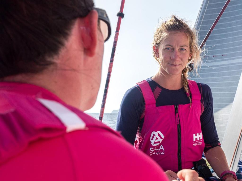 Sophie receives a bit of a debrief from Libby on the weather, navigation, and location of Team Brunel and Team Campos - Team SCA - Around Canaries 2014 © Team SCA