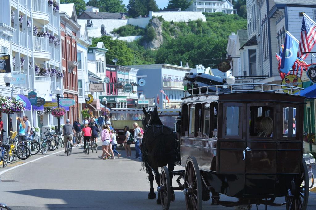 Bicycle and buggy are the modes of transportation on tiny Mackinac Island, which welcomes racers with open arms - Bell’s Beer 90th Consecutive Bayview Mackinac Race 2014 © Martin Chumiecki