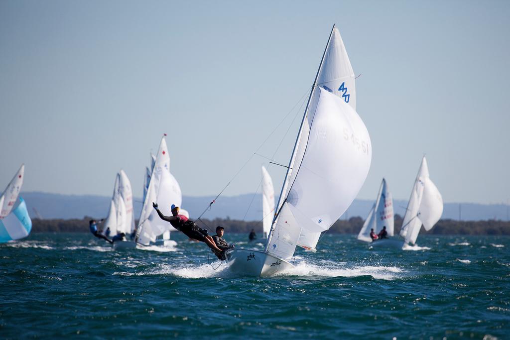 420 fleet heads downwind on a tight reach in the first heat of the day. © Andrew Gough