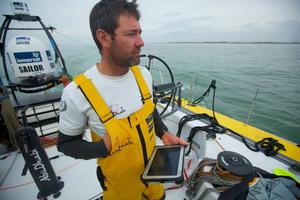 Simon Fisher navigates the final few miles to Gosport using his tablet computer - Abu Dhabi Ocean Racing - Trans Atlantic Return crossing July 2014 photo copyright Abu Dhabi Ocean Racing (ADOR)  taken at  and featuring the  class