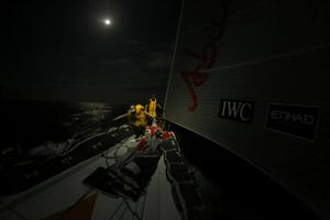 Justin Slattery and Luke Parkinson work by the light of a full moon - Abu Dhabi Ocean Racing - Trans Atlantic Return crossing July 2014 photo copyright Abu Dhabi Ocean Racing (ADOR)  taken at  and featuring the  class