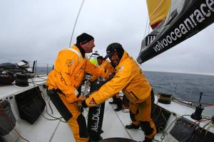 Ian Walker and Adil Khalid grimace with the effort of shaking out a reef in Azzam's mainsail - Abu Dhabi Ocean Racing - Trans Atlantic Return crossing July 2014 photo copyright Abu Dhabi Ocean Racing (ADOR)  taken at  and featuring the  class