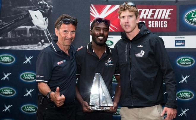 Land Rover France Ambassador Eric Loizeau (left) with Suleiman Al Manji (centre) and Emirates Team New Zealand Skipper Peter Burling (right) receiving his Land Rover Above and Beyond Award. © Lloyd Images