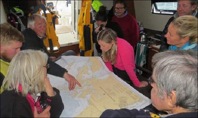 Aventura and Suilven crew look at NWP chart - Blue Planet Odyssey  © Cornell Sailing Events