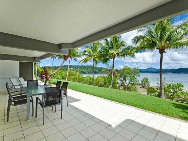 You will love the outdoor patio at Frangipani 004 - directly opposite the beach! © Kristie Kaighin http://www.whitsundayholidays.com.au