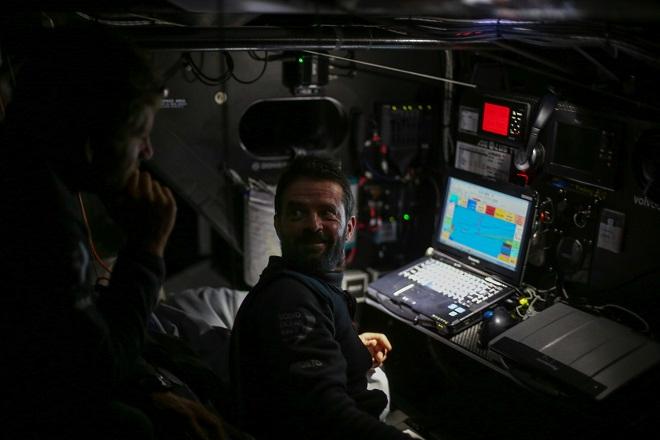 November 04, 2014. Leg one onboard Dongfeng Race Team. Pascal Bidégorry and Charles Caudrelier reaction after seeing Abu Dhabi Ocean Racing on the AIS ( Automatic Identification System) - Volvo Ocean Race 2014-15 © Yann Riou / Dongfeng Race Team