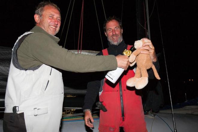 Swish's mascot takes a sip of Lanson too! L-R: Paul Pegg, Nick Legatt and Monkey - Sevenstar Round Britain and Ireland Race 2014 © Patrick Eden/RORC