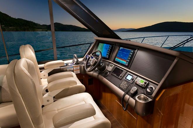 The 565 SUV has an impressive sports-styled helm station and the latest in marine navigation and instrumentation technology. © Riviera . http://www.riviera.com.au