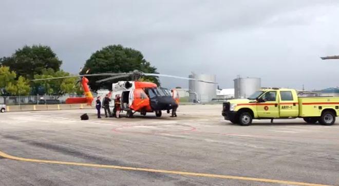 An MH-60 aircrew with Coast Guard Air Station Clearwater assists a man they medically evacuated east of St. Augustine, Florida, Oct. 4, 2014. The man was rescued after suffering from exhaustion from an inflatable hydro bubble while enroute to Bermuda. © U.S. Coast Guard