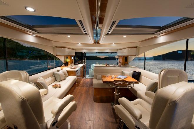 Two large sliding glass sunroof hatches bring light and fresh air into the 565's spacious and comfortable saloon, which has a comfortable seat for everyone. © Riviera . http://www.riviera.com.au