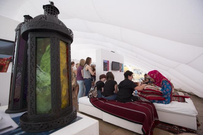 Aberdeen Asset Management Cowes Week 2013. Images showing customers inside the Visit Oman tent.   © Mark Lloyd http://www.lloyd-images.com