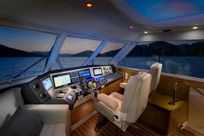 The comfortable wrap-around helm of the 63 Enclosed Flybridge offers the latest in marine technology. © Riviera . http://www.riviera.com.au