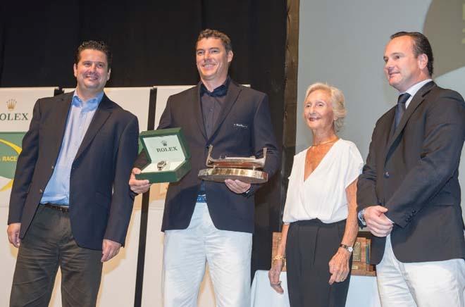 The Hon Dr. Edward Zammit Lewis, Minister of Tourism, Mrs. Dora Ripard of RLR and Mr. Lionel Schurch from Rolex presenting the  Malta Tourism Authority Trophy for first foreign boat and the RLR Trophy for the first yacht across the finish line and a Rolex Chronometer for the first boat to cross the finish line to Slovenian Olympic Medalist Vassilij Zbogar on behalf of Igor Simcic and Esimit Europa 2. ©  Rolex/ Kurt Arrigo http://www.regattanews.com