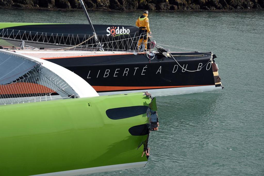 French skipper Thomas Coville's damaged Class Ultime multihull `` Sodebo Ultim' `` arrives in Roscoff harbour after hittting a cargo boat during the 10th edition of the Route du Rhum sailing race in Saint-Malo, western France, on November 3, 2014. The Route du Rhum is a solo race held every four years between Saint-Malo to Pointe-a-Pitre, in the French West Indies. AFP PHOTO / DAMIEN MEYER photo copyright @ AFP taken at  and featuring the  class