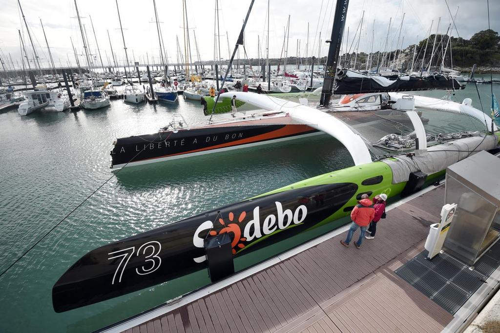 French skipper Thomas Coville's damaged Class Ultime multihull `` Sodebo Ultim' `` is pictured in Roscoff harbour after it hit a cargo boat during the 10th edition of the Route du Rhum sailing race in Saint-Malo, western France, on November 3, 2014. The Route du Rhum is a solo race held every four years between Saint-Malo to Pointe-a-Pitre, in the French West Indies. AFP PHOTO / DAMIEN MEYER photo copyright @ AFP taken at  and featuring the  class