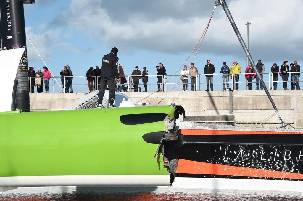 French skipper Thomas Coville's damaged Class Ultime multihull `` Sodebo Ultim' `` is pictured in Roscoff harbour after it hit a cargo boat during the 10th edition of the Route du Rhum sailing race in Saint-Malo, western France, on November 3, 2014. The Route du Rhum is a solo race held every four years between Saint-Malo to Pointe-a-Pitre, in the French West Indies. AFP PHOTO / DAMIEN MEYER photo copyright @ AFP taken at  and featuring the  class