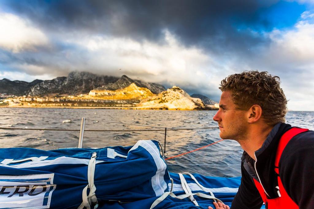 September 6, 2014. Nicolai Sehested looks onto the African Coast going through the Straits of Gibraltar.  © Brian Carlin - Team Vestas Wind