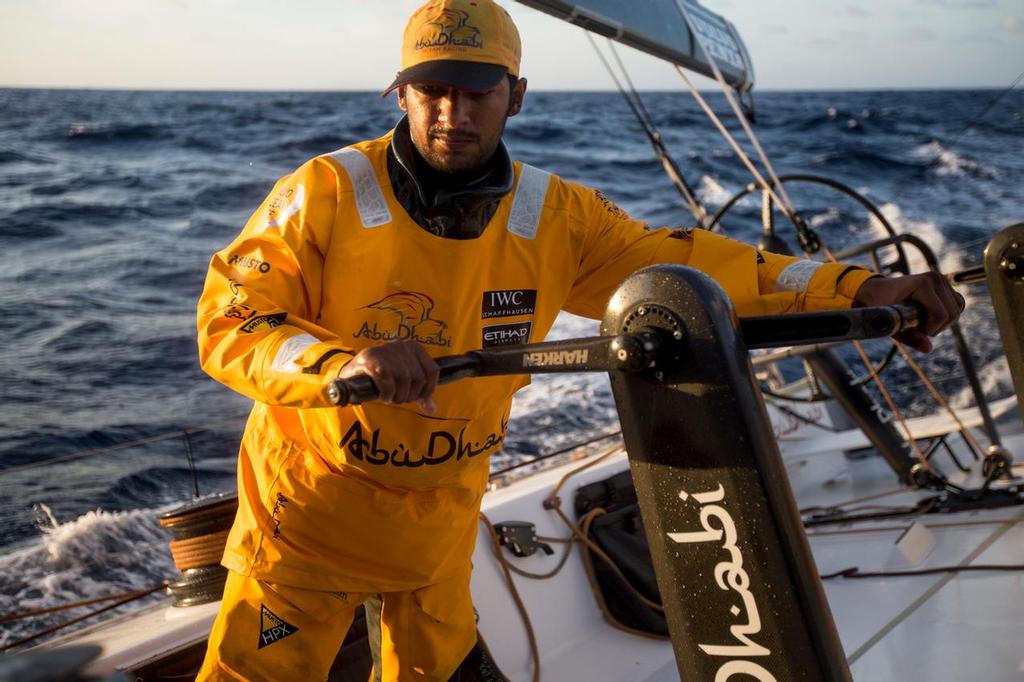 October, 2014. Leg 1 onboard Abu Dhabi Ocean Racing. Adil Khalid is grinding to trim the sails. © Matt Knighton/Abu Dhabi Ocean Racing