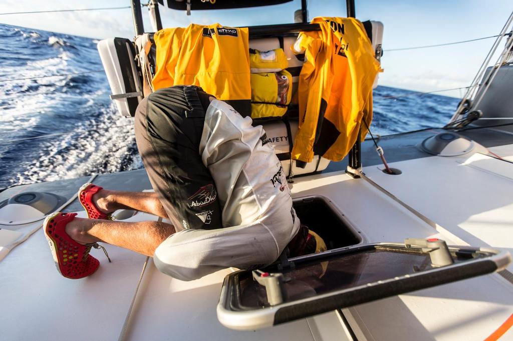 October 26, 2014. Leg 1 onboard Abu Dhabi Ocean Racing. Phil Harmer checking who knows what down below. photo copyright Matt Knighton/Abu Dhabi Ocean Racing taken at  and featuring the  class