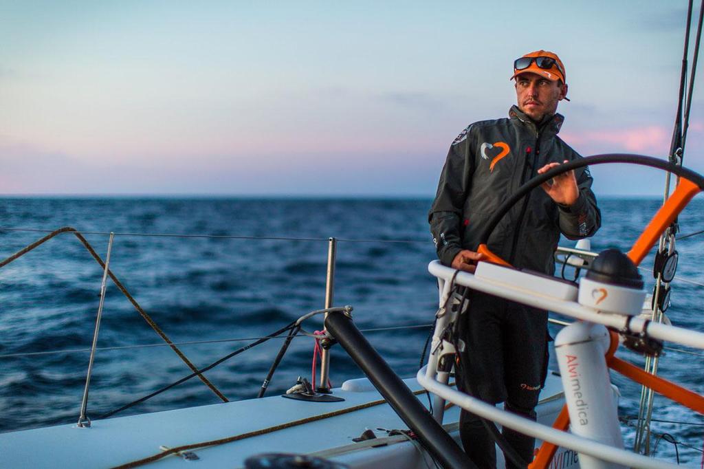 2014-15 Volvo Ocean Race - October 16, 2014. Leg 1 onboard Team Alvimedica. Day 5. Through the Canary Islands, the drag race continues along the coast of the Western Sahara. Alberto Bolzan takes the helm of Alvimedica at the end of day 5. photo copyright  Amory Ross / Team Alvimedica taken at  and featuring the  class