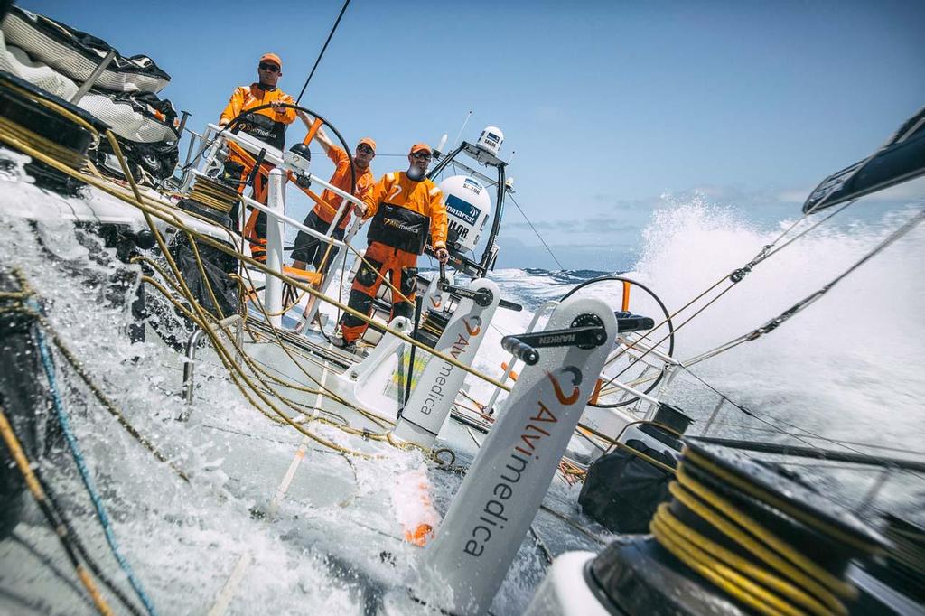 2014-15 Volvo Ocean Race. October 19, 2014. Leg 1 onboard Team Alvimedica. Day 8. Day of the Cape Verdes transit and decision time for the Equator / Doldrums approach. Ryan Houston, Seb Marsset, and Dave Swete enjoying a final afternoon of fast Tradewind sailing on the way south towards the Equator. photo copyright  Amory Ross / Team Alvimedica taken at  and featuring the  class