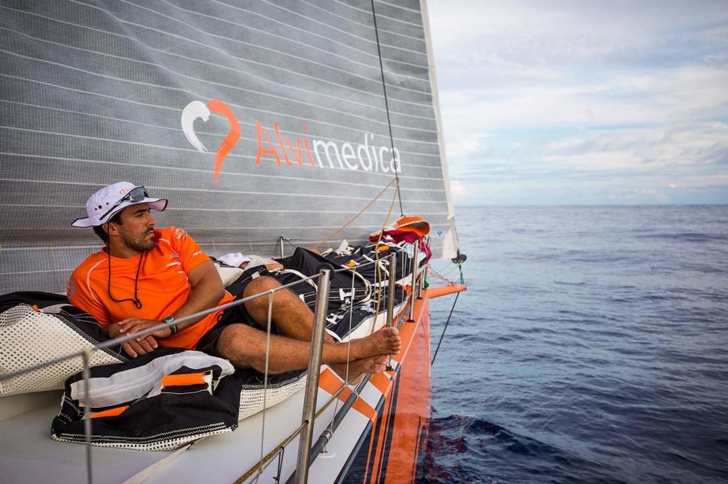 October 21, 2014.  Leg 1 onboard Team Alvimedica. Day 10 brings the fleet into the ITCZ and the notoriously challenging Doldrums, an area of volatile and unpredictable weather. Mark Towill spends his off watch on the bow, far cooler than the bunk down below decks. Volvo Ocean Race ©  Amory Ross / Team Alvimedica