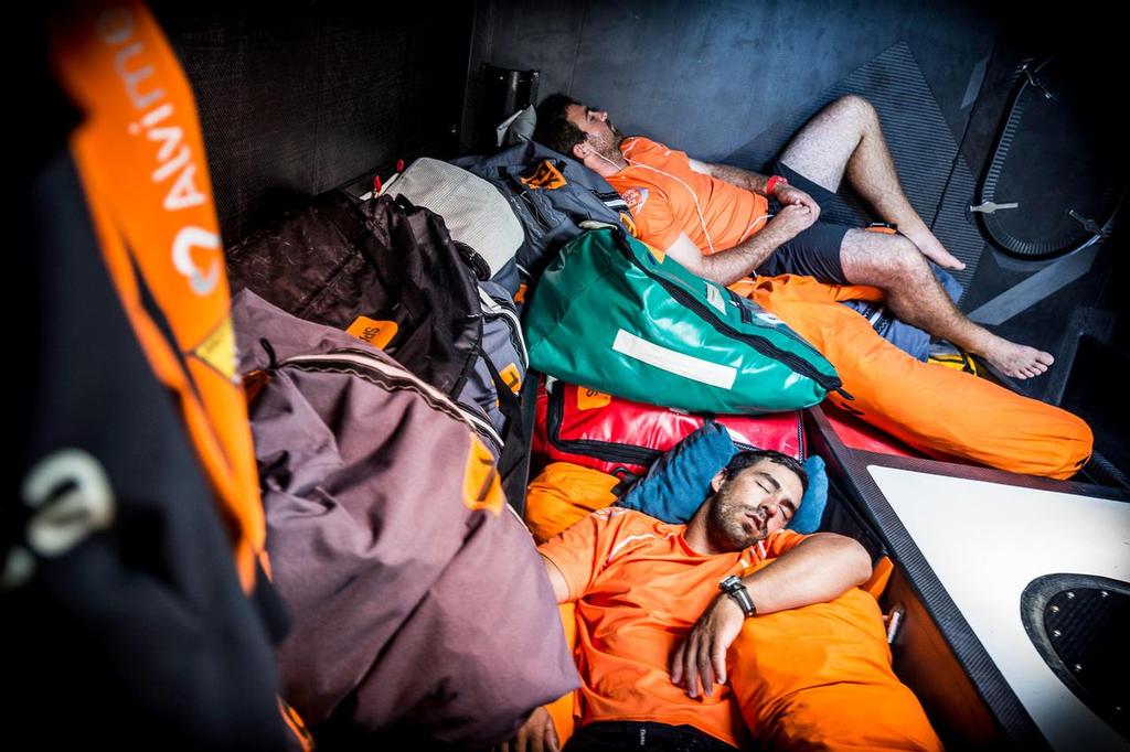 October 22, 2014. Leg 1 onboard Team Alvimedica. Day 11. The third day in the clutches of the Doldrums brings no breaks for Team Alvimedica, still searching for consistent winds and a way south with the fleet. Charlie Enright (T) and Mark Towill (B) catch some sleep in the bow where weight is best kept in light winds. ©  Amory Ross / Team Alvimedica