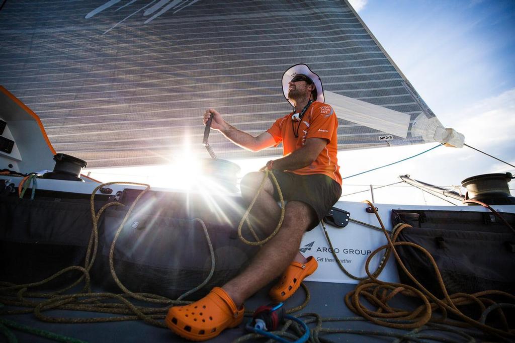October 22, 2014. Leg 1 onboard Team Alvimedica. Day 11. The third day in the clutches of the Doldrums brings no breaks for Team Alvimedica, still searching for consistent winds and a way south with the fleet. Charlie Enright trims the Code Zero sail from the cockpit. ©  Amory Ross / Team Alvimedica