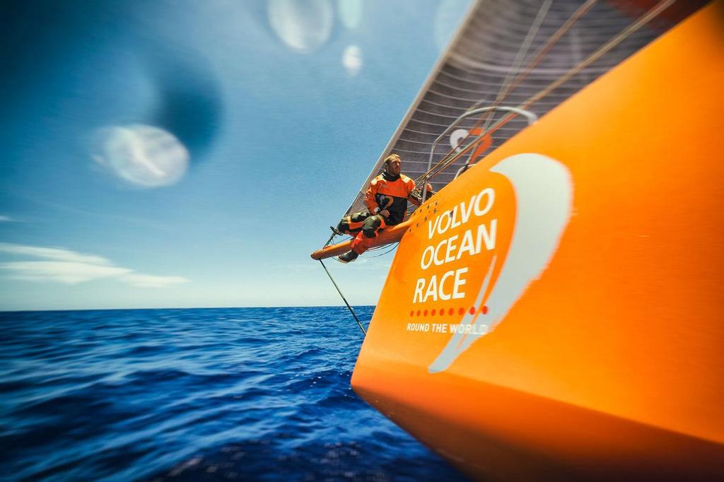 October 26, 2014. Leg 1 onboard Team Alvimedica. Day 15. Conditions on the way south along the Brazilian coast are excellent and the miles to Cape Town begin to disappear quickly. Nick Dana cautiously works his way back to the boat after tending to work on the end of the bow sprit. Volvo Ocean Race. photo copyright  Amory Ross / Team Alvimedica taken at  and featuring the  class