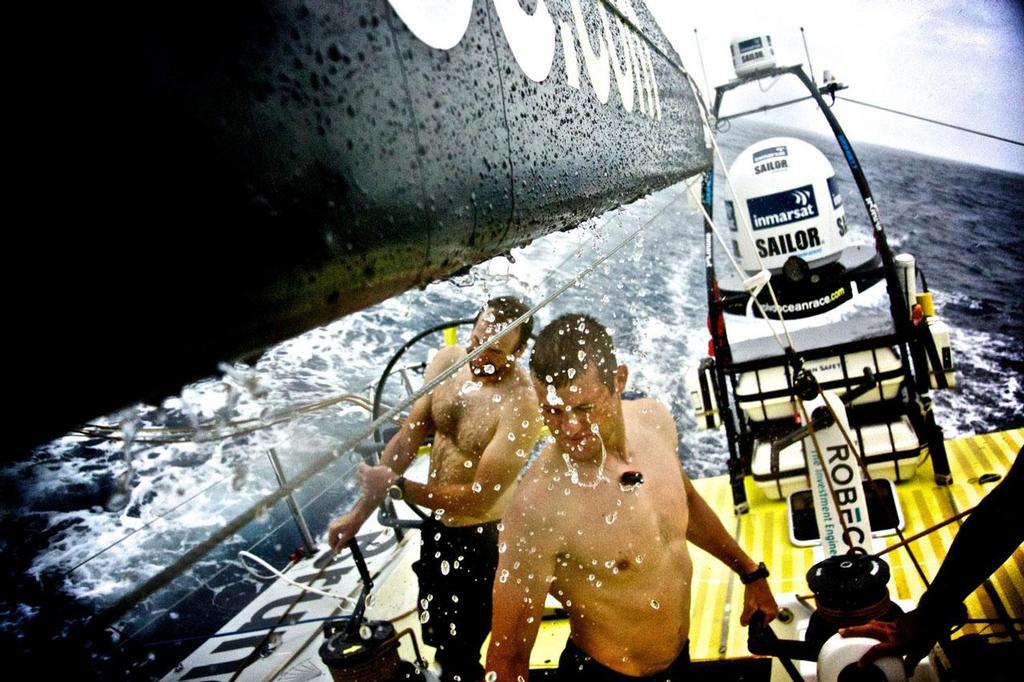 The crew enjoy the fresh water on their faces. © Stefan Coppers/Team Brunel