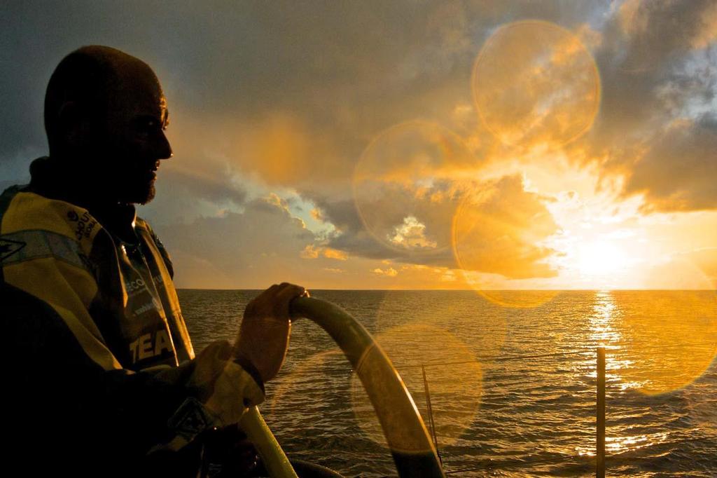 October 21, 2014. Leg 1 onboard Team Brunel. The calm after the rain and strong winds. The crew are damp but enjoy the sunset. Volvo Ocean Race photo copyright Stefan Coppers/Team Brunel taken at  and featuring the  class