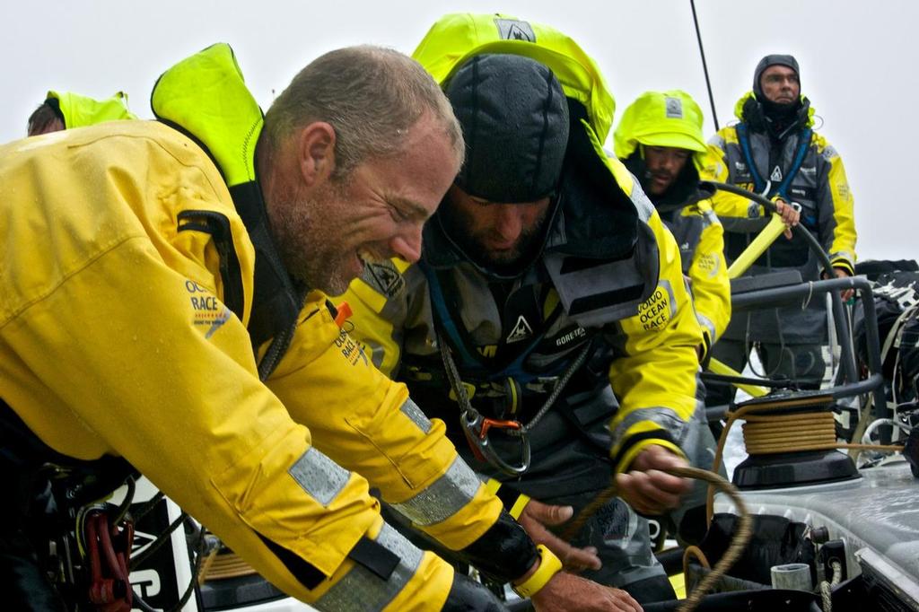 October 30, 2014. Leg 1 onboard Team Brunel. The crew are surprisingly cheery as they sort the ropes in wet conditions. © Stefan Coppers/Team Brunel