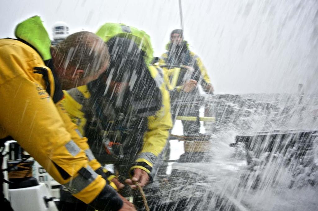 Waves crash over the boat as the team head further south.  © Stefan Coppers/Team Brunel
