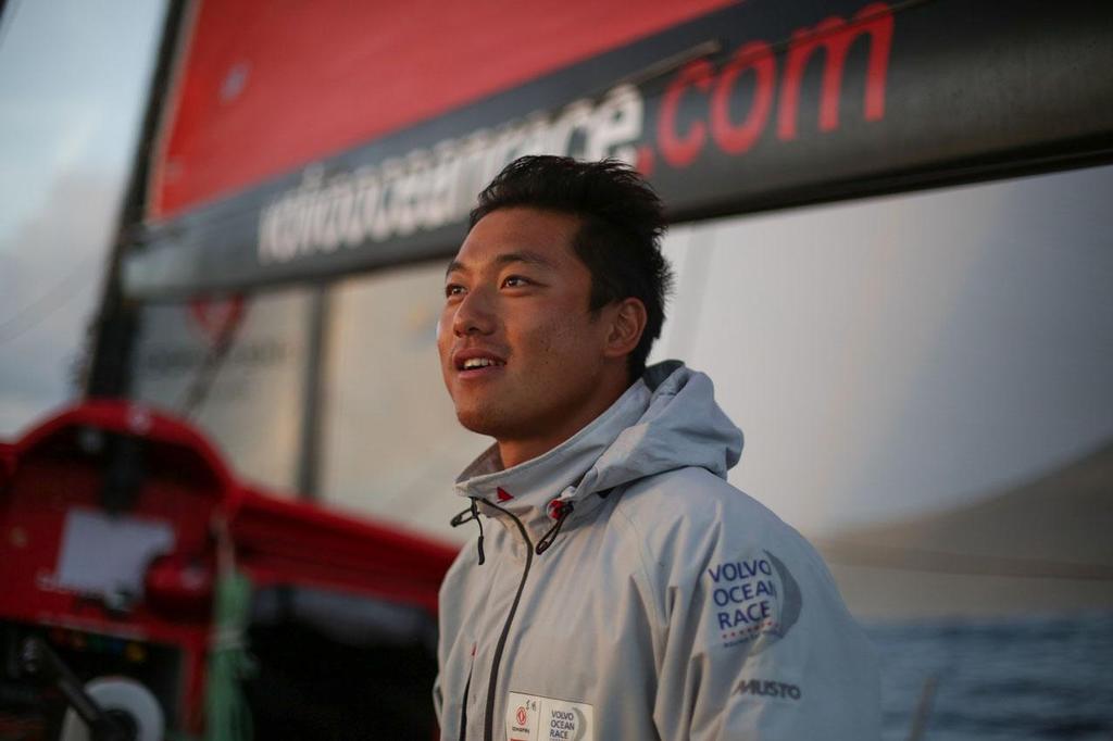 October 20, 2014. Leg 1 onboard Dongfeng Race Team: Jin Hao Chen, aka Horace, on watch. Volvo Ocean Race photo copyright Yann Riou / Dongfeng Race Team taken at  and featuring the  class