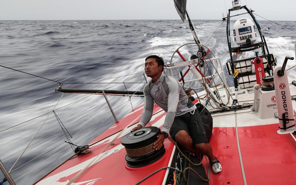 October 27, 2014. Leg 1 onboard Dongfeng Race Team, Jin Hao Chen, aka Horace, trimming the sails. © Yann Riou / Dongfeng Race Team