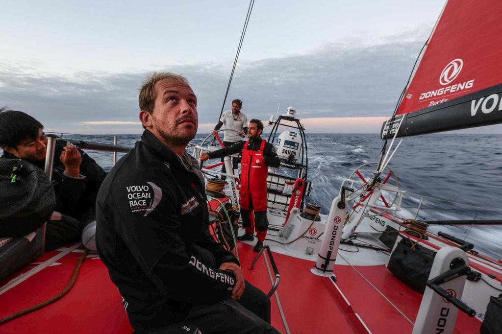 Volvo Ocean Race - October 29, 2014. Leg 1 onboard Dongfeng Race Team. Kevin Escoffier on deck, gybing and heading south. photo copyright Yann Riou / Dongfeng Race Team taken at  and featuring the  class