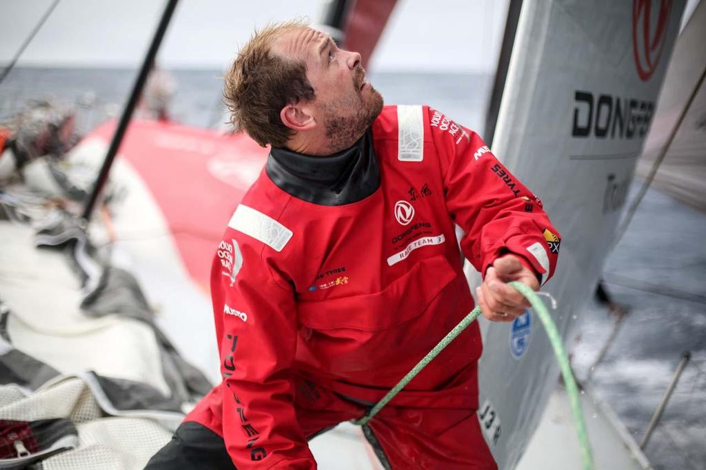 Kevin Escoffier with a look of concentration, on the foredeck trying to adjust the headsail for maximum speed and power. © Yann Riou / Dongfeng Race Team