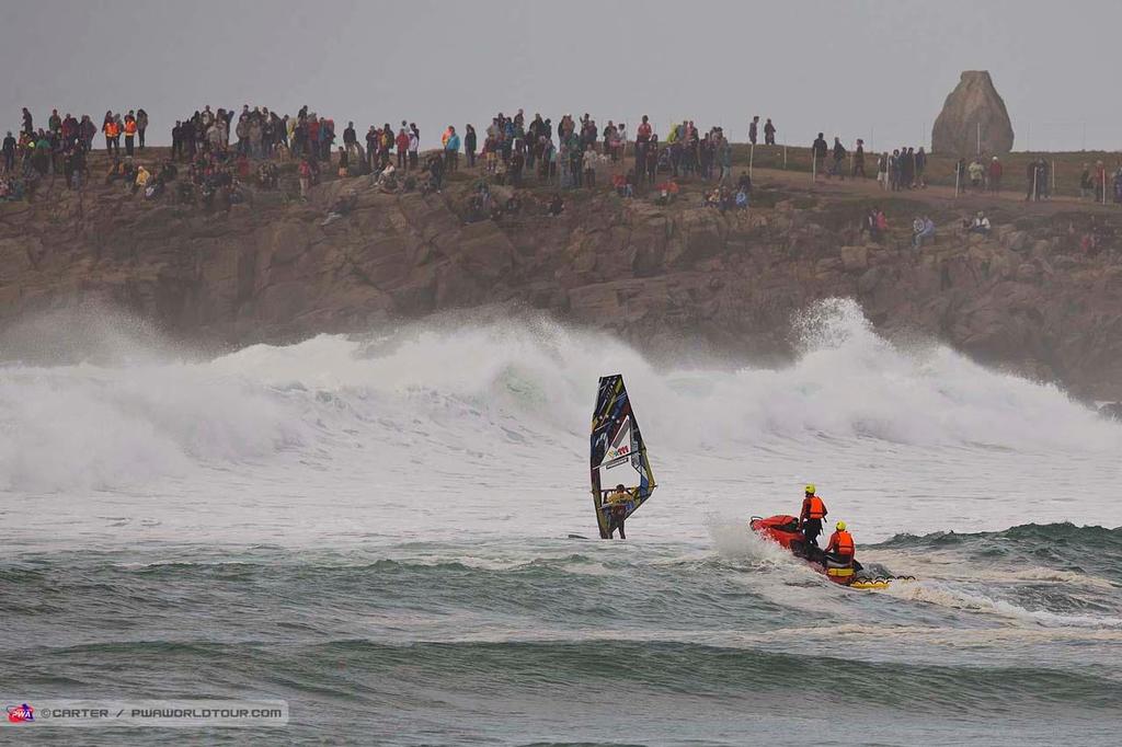 Heading out in big surf - 2014 La Torche PWA Grand Slam photo copyright  Carter/pwaworldtour.com http://www.pwaworldtour.com/ taken at  and featuring the  class