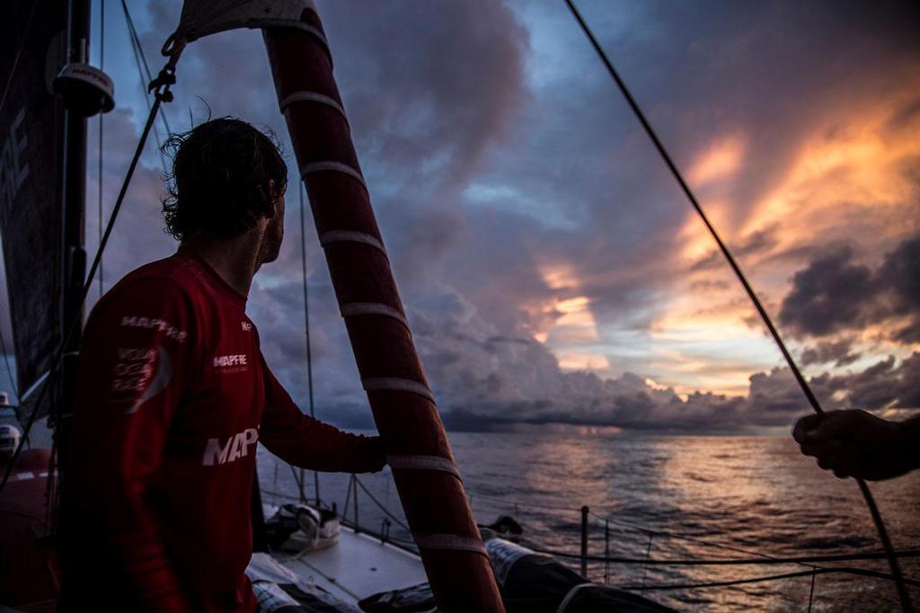 October 20, 2014. Leg 1 onboard MAPFRE. Iker Martinez enjoying a beautiful sunrise but very stressful at the same time because those clouds are taking all the wind from MAPFRE. Volvo Ocean Race photo copyright Francisco Vignale/Mapfre/Volvo Ocean Race taken at  and featuring the  class