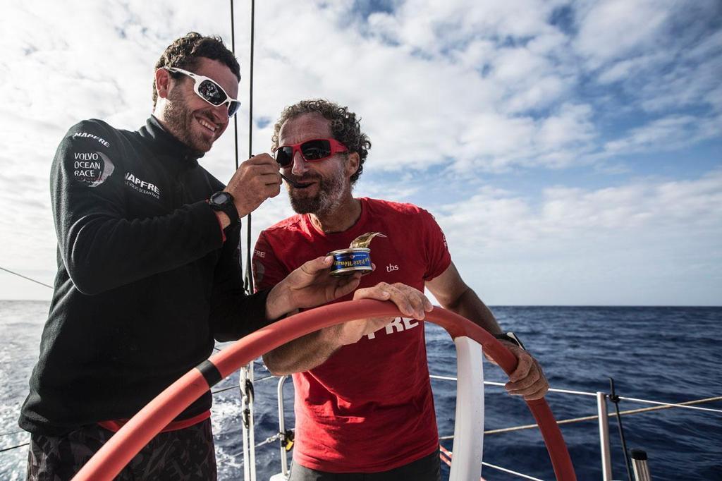 Volvo Ocean Race - October 30, 2014. Leg 1 onboard MAPFRE. Michel Desjoyeaux, Anthony Marchand enjoying PATE de HENAFF. photo copyright Francisco Vignale/Mapfre/Volvo Ocean Race taken at  and featuring the  class