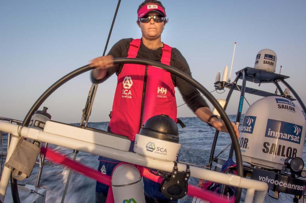 2014-15 Volvo Ocean Race - October, 2014. Leg 1 onboard Team SCA. Sally Barkow helms west on board Team SCA. photo copyright Corinna Halloran / Team SCA taken at  and featuring the  class
