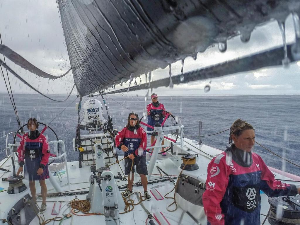 October 21, 2014. Leg 1 onboard Team SCA. The girls watch for pressure during a squall. photo copyright Corinna Halloran / Team SCA taken at  and featuring the  class