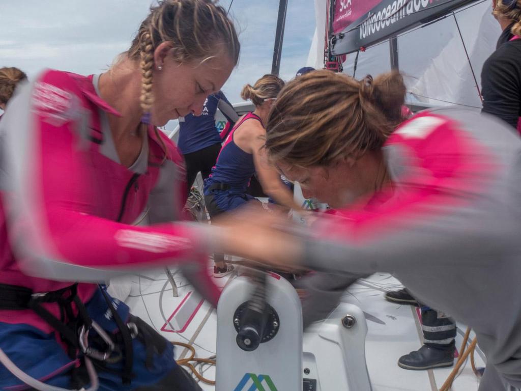 Volvo Ocean Race - October 28, 2014.  Leg 1 onboard Team SCA. Sophie Ciszek and Sally Barkow grind during a gybe. photo copyright Corinna Halloran / Team SCA taken at  and featuring the  class