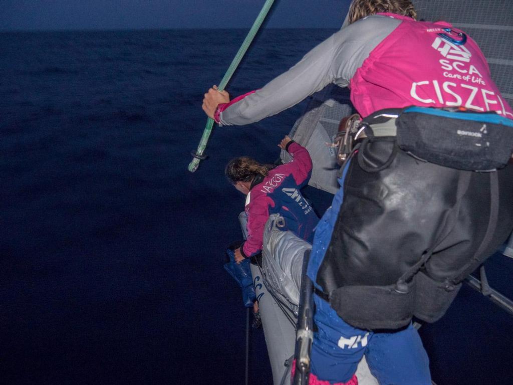 Volvo Ocean Race - October 28, 2014.  Leg 1 onboard Team SCA. Sophie Ciszek takes the haylard from Stacey Jackson after a sail change. photo copyright Corinna Halloran / Team SCA taken at  and featuring the  class